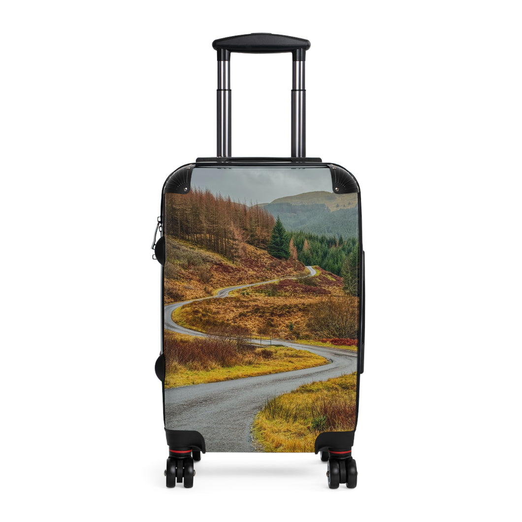 Suitcase | Serpentine Journey: The Winding Road Through Highland Tranquility